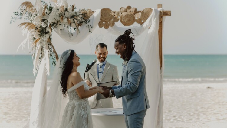 Couple married on the beach by Officiant