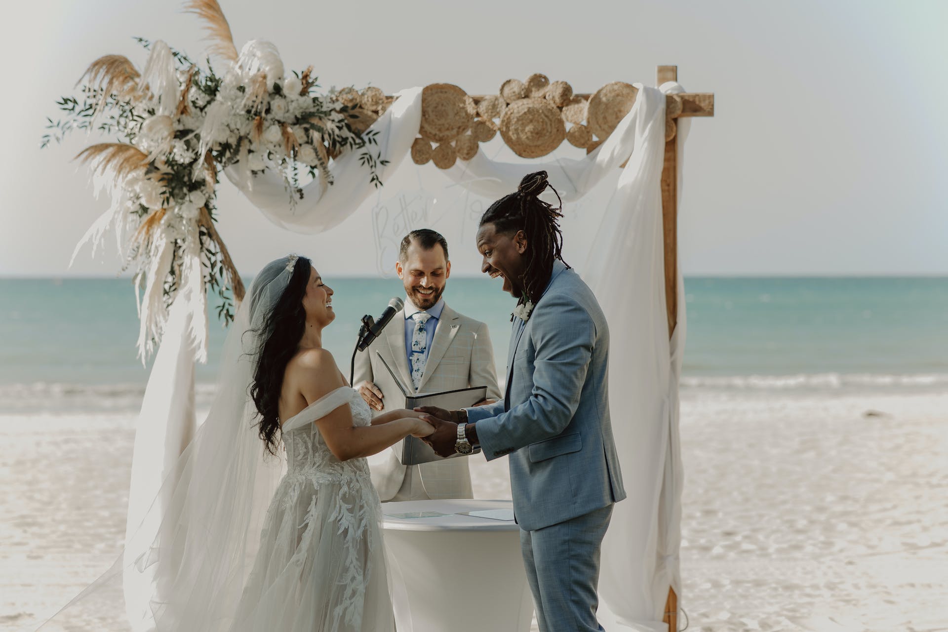 Couple married on the beach by Officiant