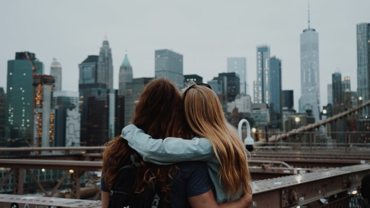 a couple enjoying the view of the new york city skyline